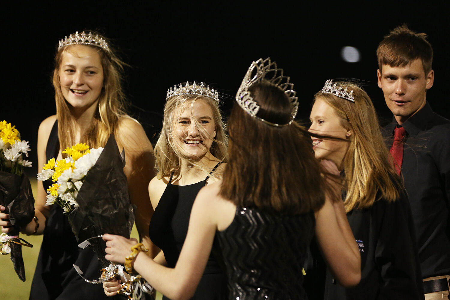 homecoming court made their way off the field after crowing the king and queen